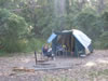 Libby reading at campsite